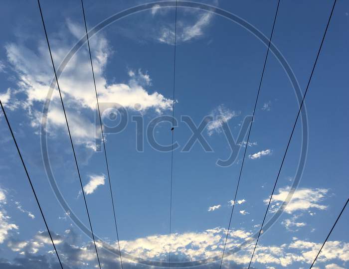 Electric wire with blue sky at outdoors