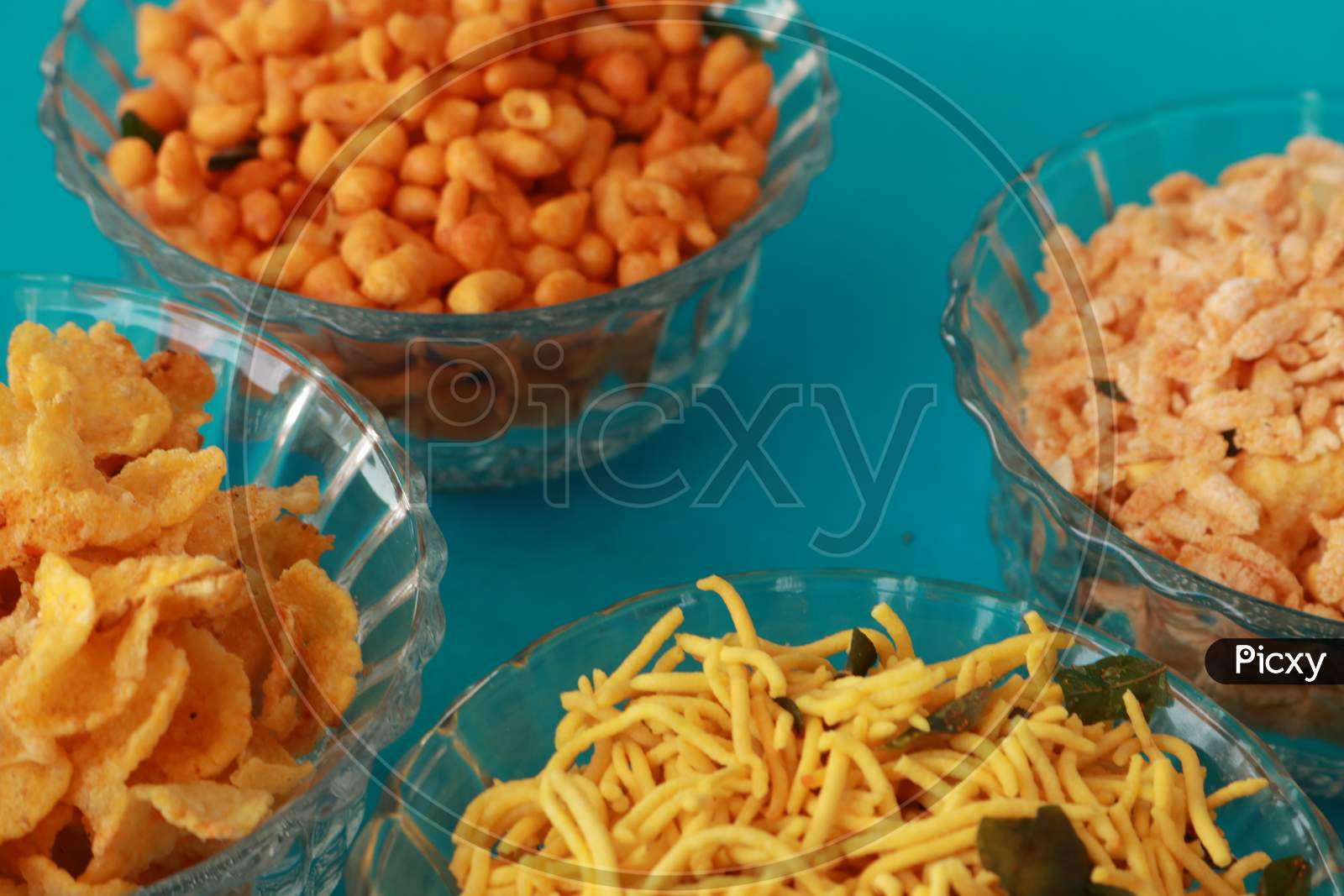 image-of-indian-snacks-with-different-kind-of-dishes-in-bowls-presented