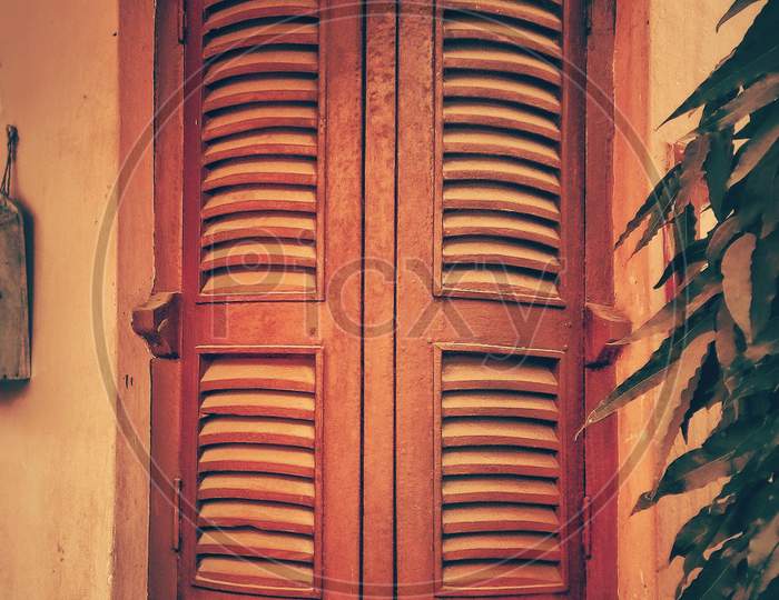Wodden Window old venice style closed orange colour