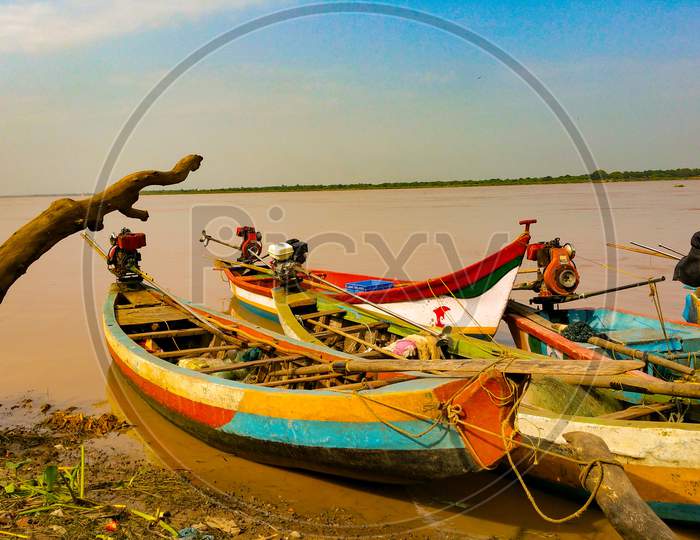 Fishing boats anchored on the banks of Godavari river.
