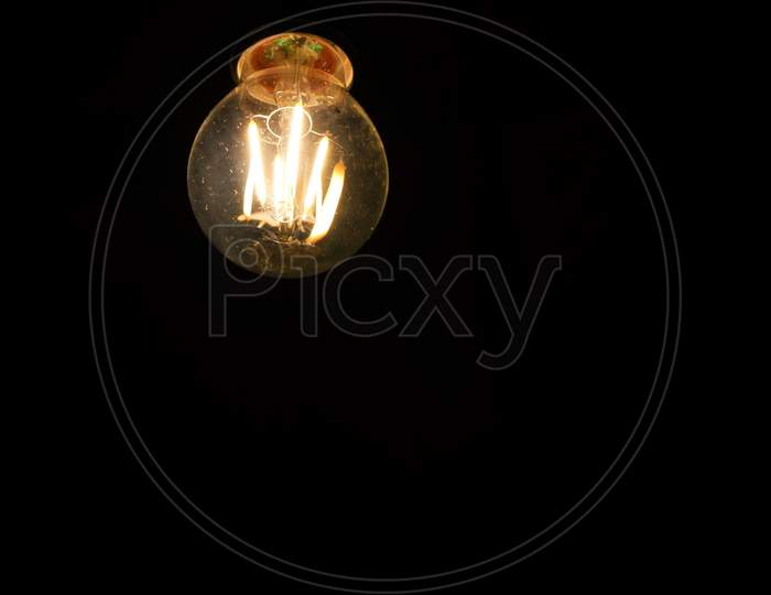 filament type bulb in black background