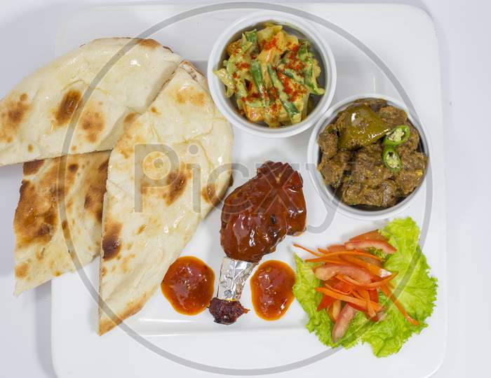 Achary Beef Curry, BBQ Chicken, Indian Style mix vegetable, plain nan and Green Salad Platter.