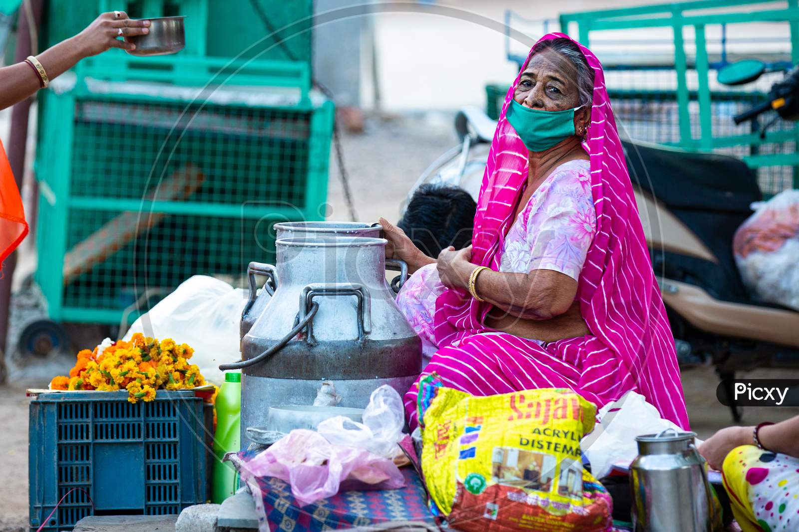 Jodhpur, Rajashtbn, India. 30 March 2020. Old Woman Wearing Protective Mask Selling Food On Road Due To Lock Down, Coronavirus, Covid-19 Outbreak In India.