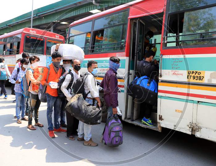 Migrant Workers Boarding Buses Towards their hometowns During Nationwide Lockdown Amidst Coronavirus Or COVID- 19 Pandemic, in Prayagraj, May 6, 2020