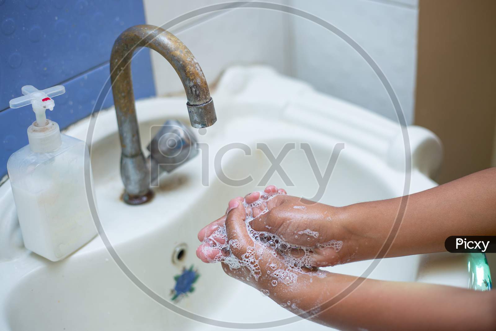 Washing Hands With Soap And Hot Water At Home Bathroom Sink Kid Cleansing Hand Hygiene For Coronavirus Outbreak Prevention. Corona Virus Pandemic Protection By Washing Hands Frequently. Closeup Of Hand Washing With Soap.