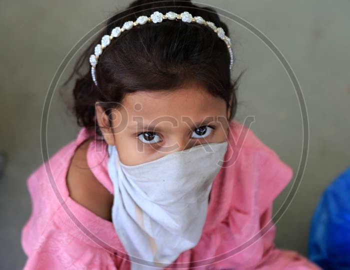 A Girl Child Of a Migrant Laborer Rests After Arriving From Gujarat State On A Special Train At Prayagraj Railway Station During Nationwide Lockdown Amidst Coronavirus Or COVID- 19 Pandemic, Prayagraj, May 10, 2020