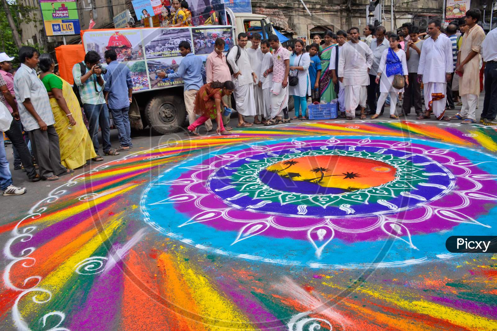colourful rangoli making on street during kolkata rathayatra festival