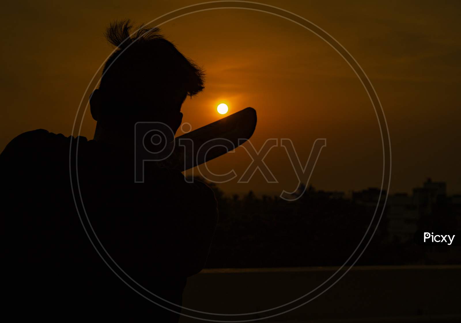 playing cricket at sunset