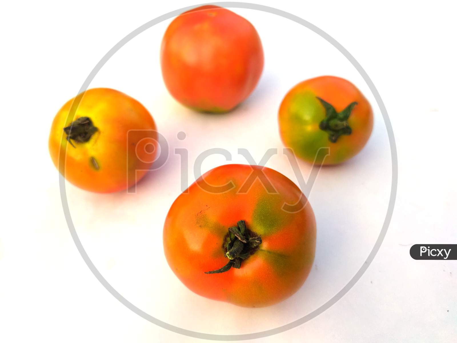 some fresh red tomato isolated on white background