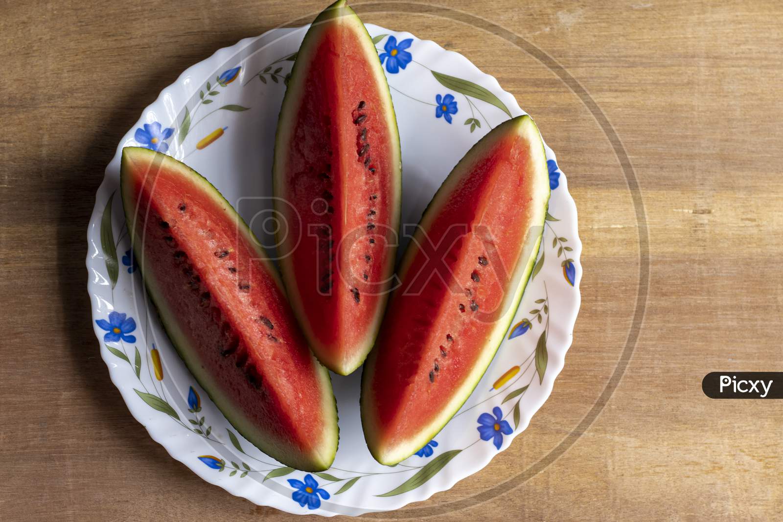 Slices Of Red Juicy Watermelon On Plate In Summer With Space For Text On Right Side
