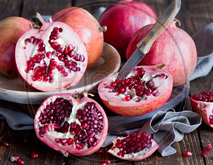 Half cut Pomegranate with knife
