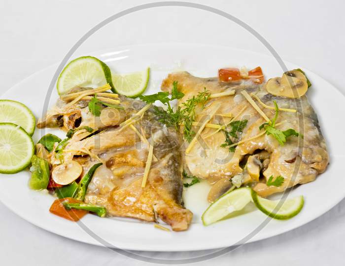 Pomfret Fish Pieces On Plate, Spicy Indian Dish. Popular Amongst Bengalis And South Asia For It'S Taste.
