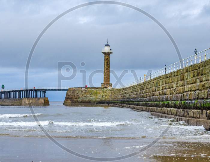 Whitby lighthouse situated on the pier at the harbour entrance