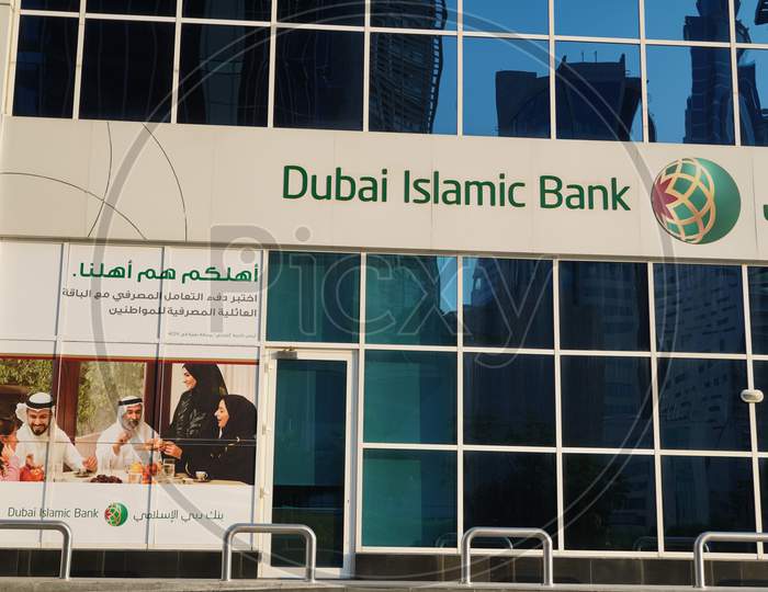 Dubai Uae December 2019 - Dubai Islamic Bank A Major Middle Eastern Banks Building Sign Logo On Large Building Top On A Sunny Day. Bank Branch Store Front.