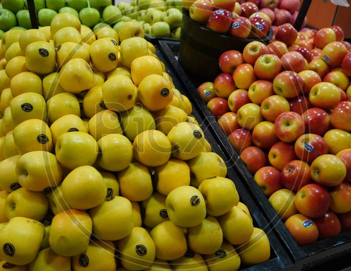 Bunch Of Red, Yellow Apples On Boxes In Supermarket. Apples Being Sold At Public Market. Organic Food Fresh Apples In Shop, Store - India