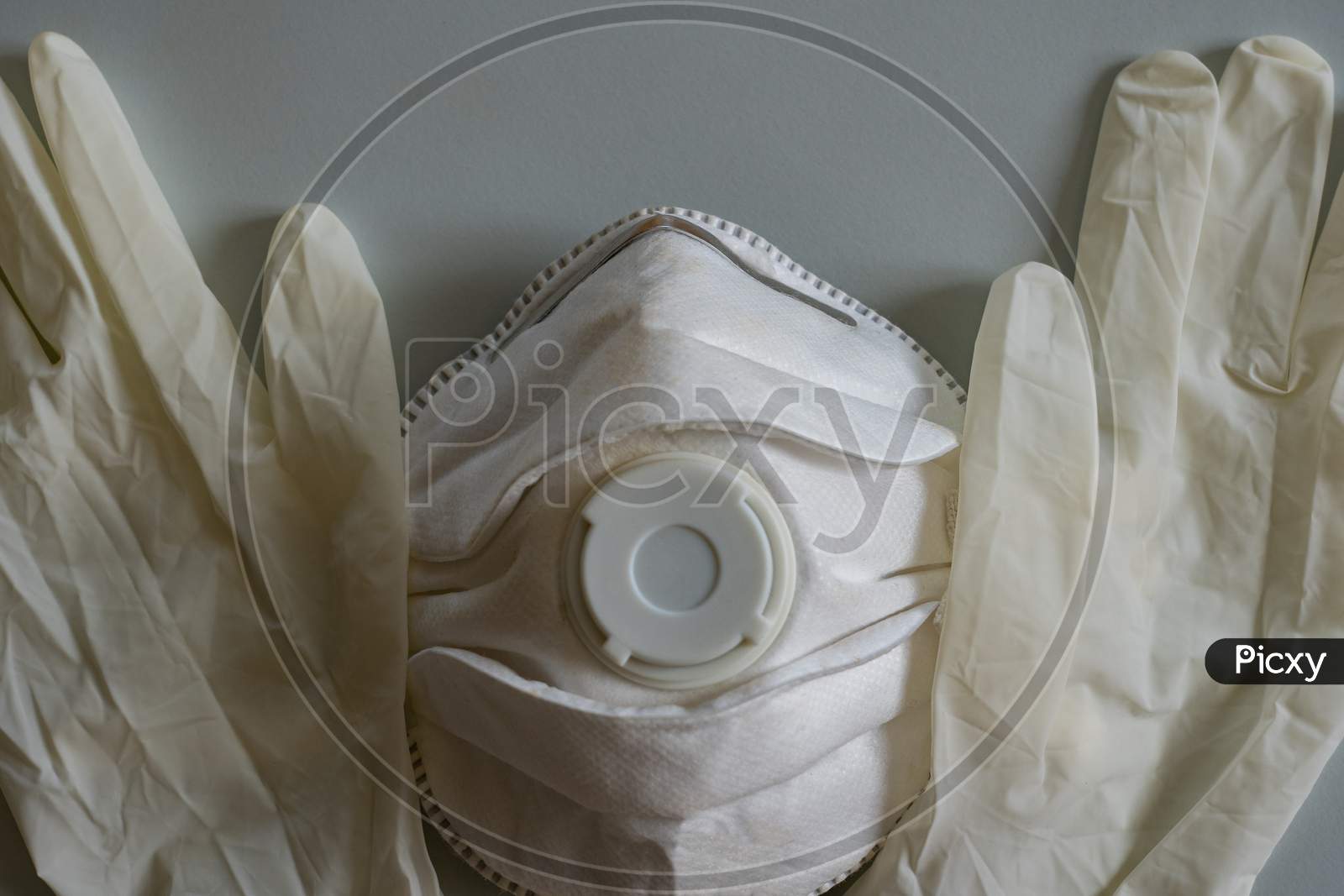 Mask protection with rubber gloves in time of influenza.