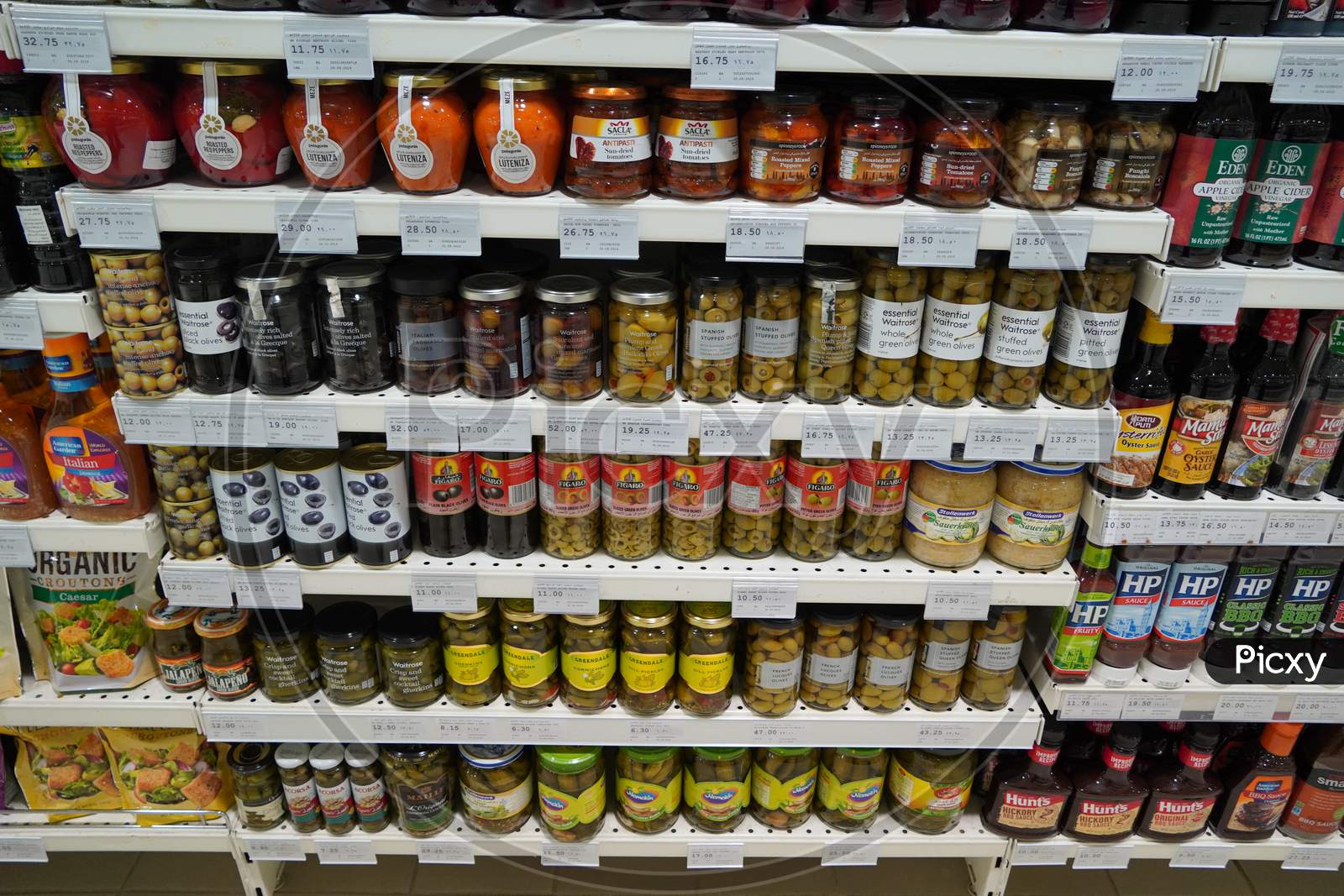 Traditional Turkish Pickles Of Various Fruits And Vegetables. Jars Of Salted Pickles On A Store Shelf. Beetroot, Olives, Cabbage, Cucumber, Onion, Tomato.