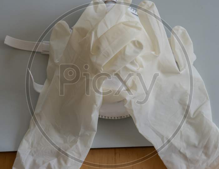 Mask protection with rubber gloves close face like being under shock.