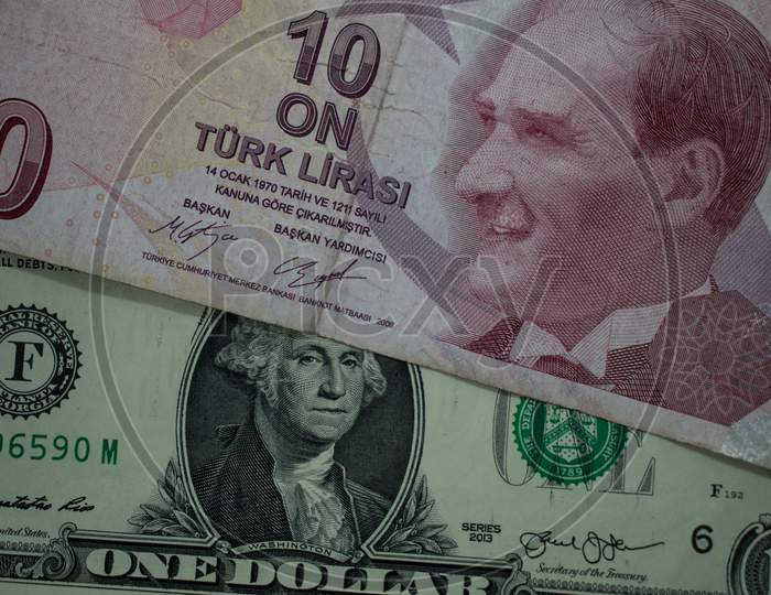 Turkish Lira and US Dollar banknotes close up image.