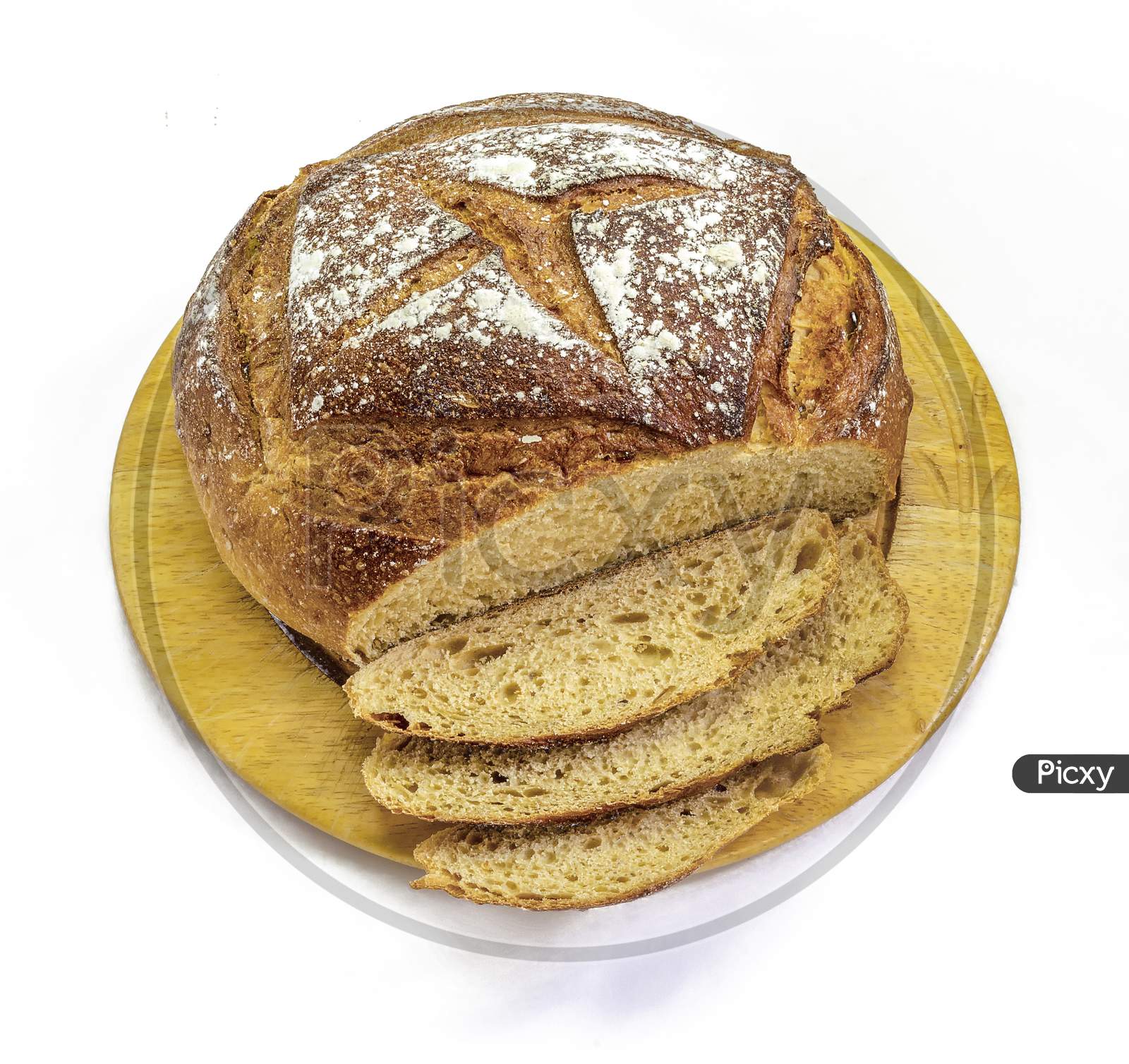 Sourdough bread on a bread board on a white background