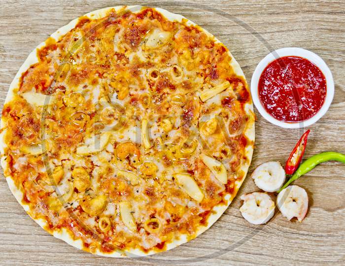 Classic Seafood Pizza With Spicy Chilli Sauce.