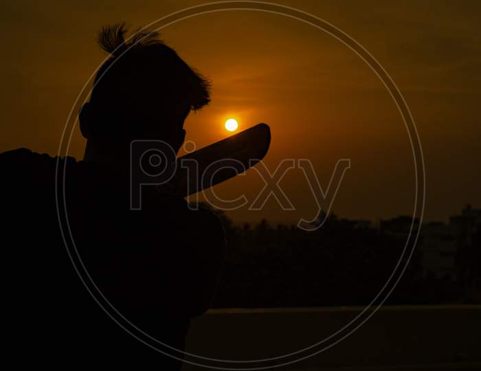 playing cricket at sunset
