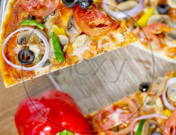 Popular Colorful Ingredients As Like Tomatoes, Cheese, Mushroom, Capsicum, Olives And Other Ingredients Baked Healthy Pizza.