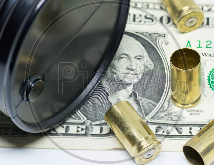 oil barrel one dollar bill and bullets oil industry war for resources concept
