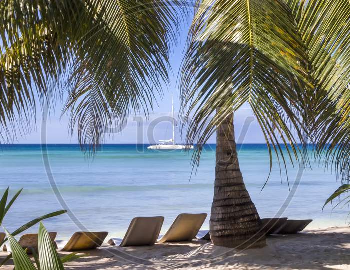 Relaxing sun lounges on a Caribbean beach