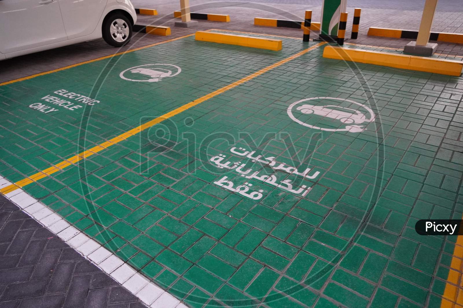 Green Electric Vehicle Charging Station Sign In A Parking Bay. Electric Vehicle Parking Space. Electric Car Charging Station. India