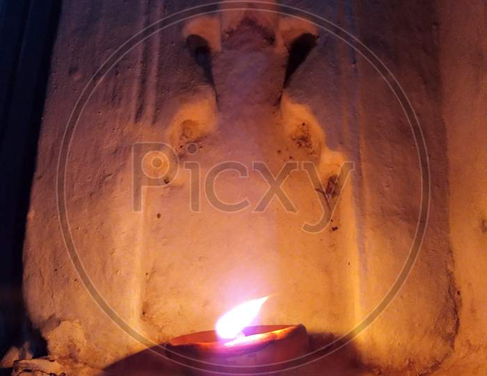 Traditional clay diya lamps lit during diwali celebration