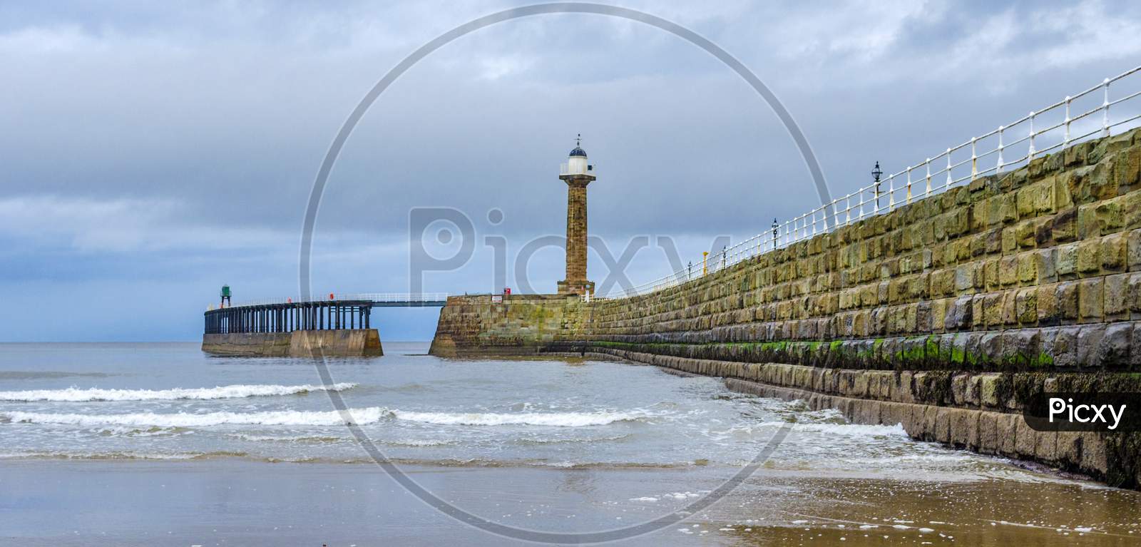 Whitby lighthouse situated on the pier at the harbour entrance