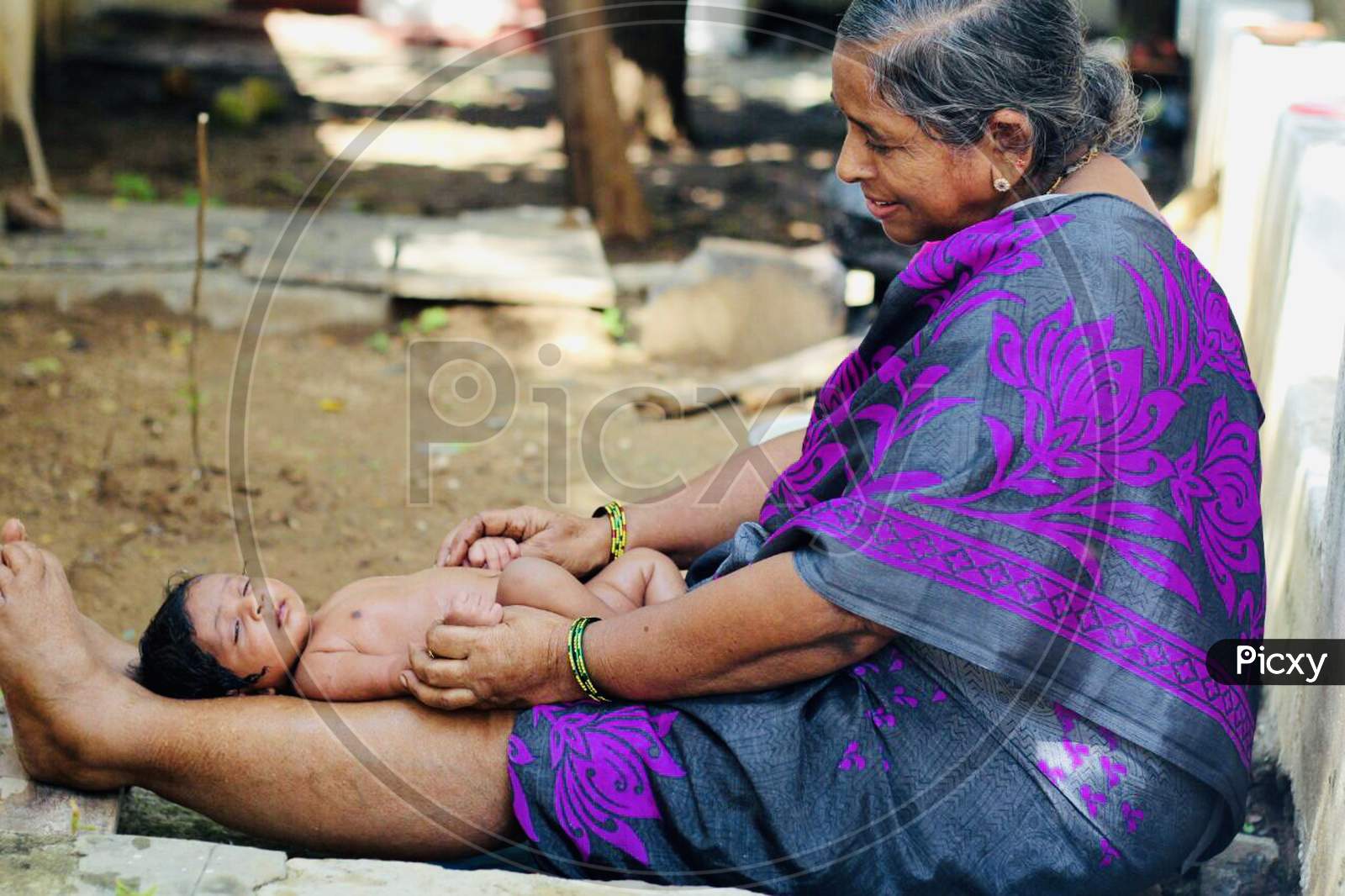 Indian traditional baby bath by Grandma's