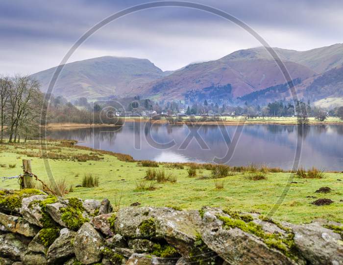 A view of Rydal water from the road with the Langdales