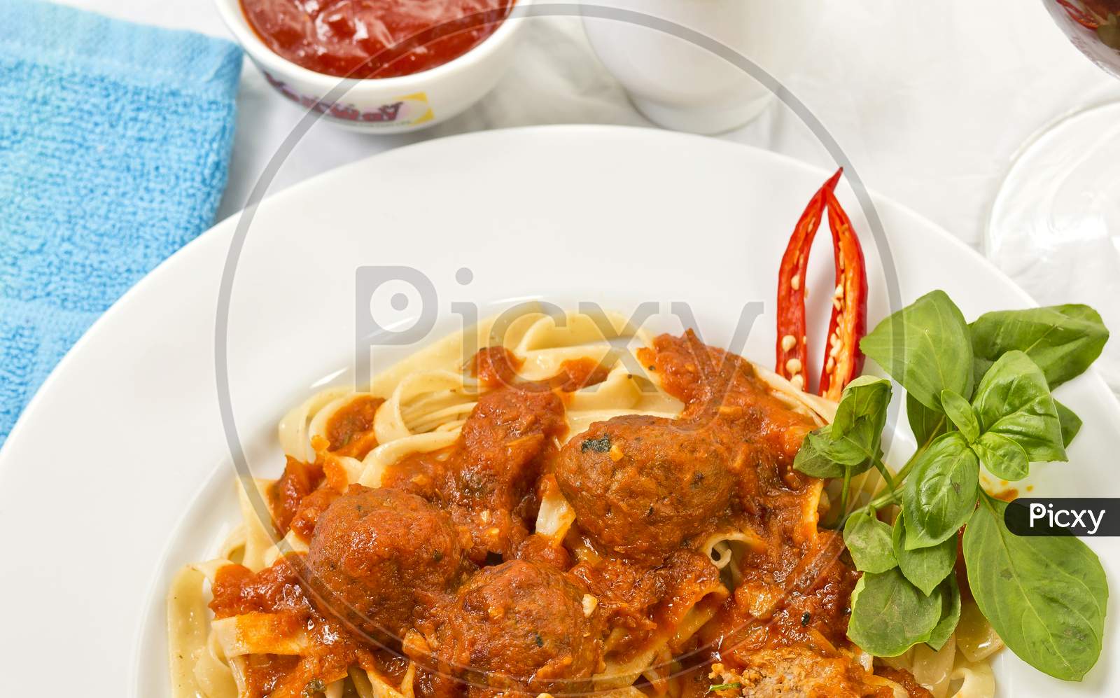 A Plate Of Fettuccine And Meatballs Pasta With Tomato Sauce.