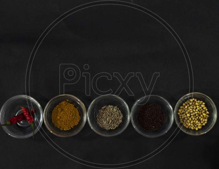 A Collection Of Indian Spices With Isolated Black Background And Space For Text