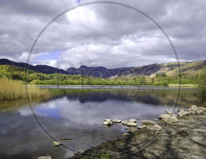 A view of calm Elter Water in the Lake District in Cumbria.