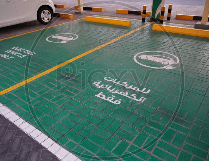Green Electric Vehicle Charging Station Sign In A Parking Bay. Electric Vehicle Parking Space. Electric Car Charging Station. India