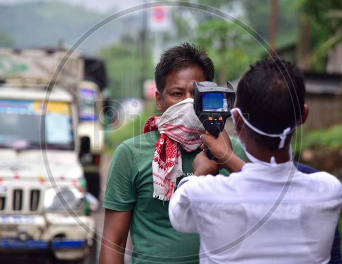 Thermal Screening Of  Commuters Being Conducted  During Nationwide Lockdown Amidst Coronavirus Or COVID-19 Pandemic  At Byrnihat In Ri Bhoi District Of Meghalaya ,India