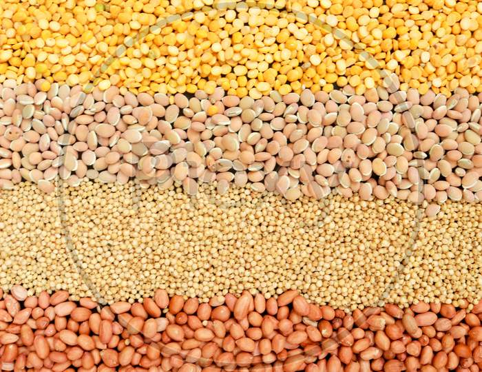 Different Kinds Of Beans And Grains On Black Background