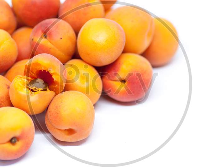 delicious ripe apricots on white