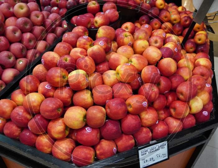 Bunch Of Red Apples On Boxes In Supermarket. Apples Being Sold At Public Market. Organic Food Fresh Apples In Shop, Store - India