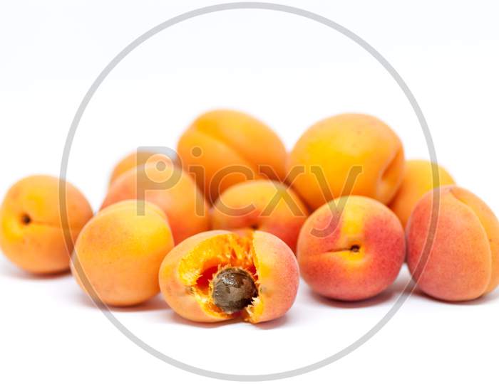 delicious ripe apricots on white