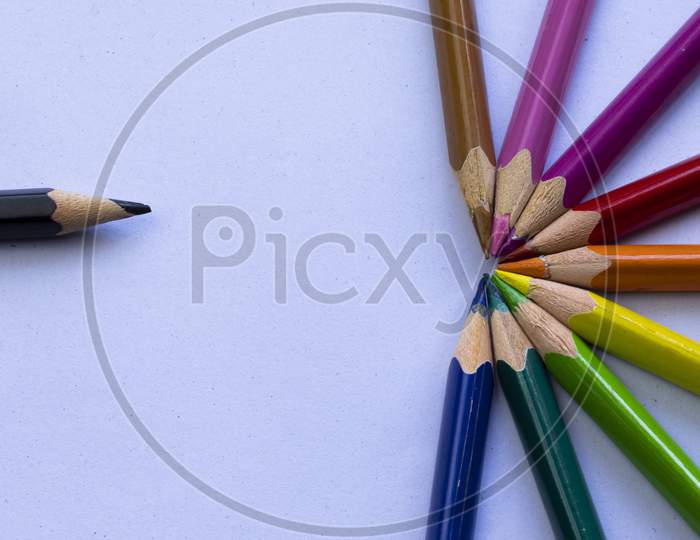 Group Of Colorful Wooden Pencils On Grainy White Background And Space For Text On Left Side