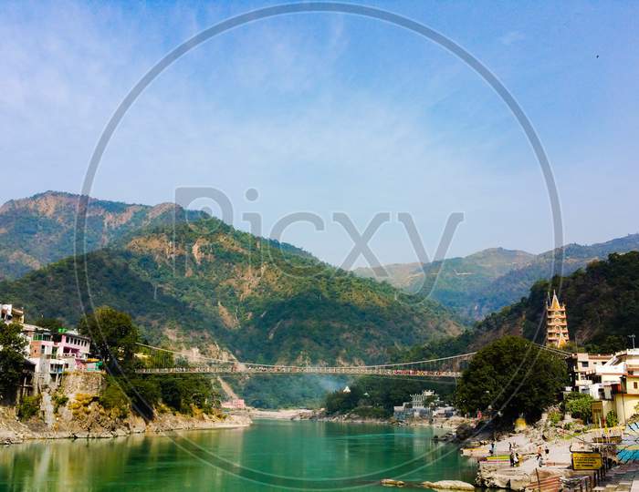 Scenic Rishikesh town on the banks of Ganga river in Indian Himalayas