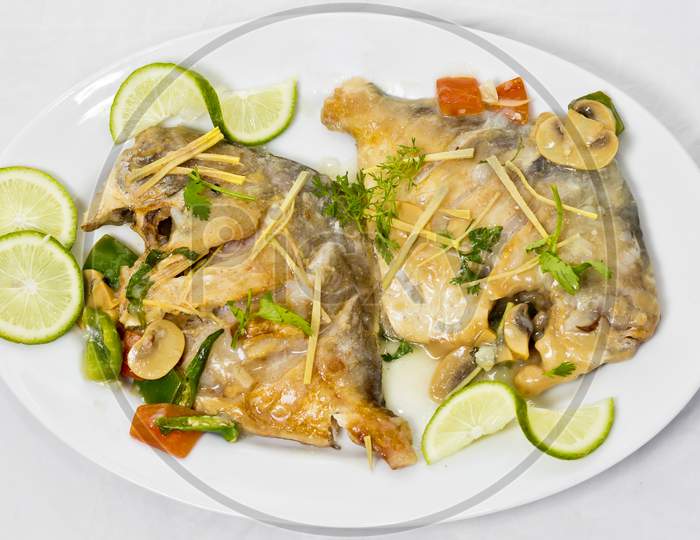 Pomfret Fish Pieces On Plate, Spicy Indian Dish. Popular Amongst Bengalis And South Asia For It'S Taste.