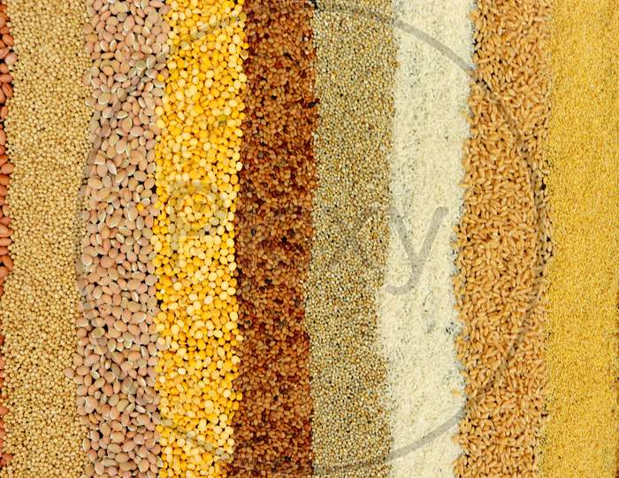 Different Kinds Of Beans And Grains On Black Background