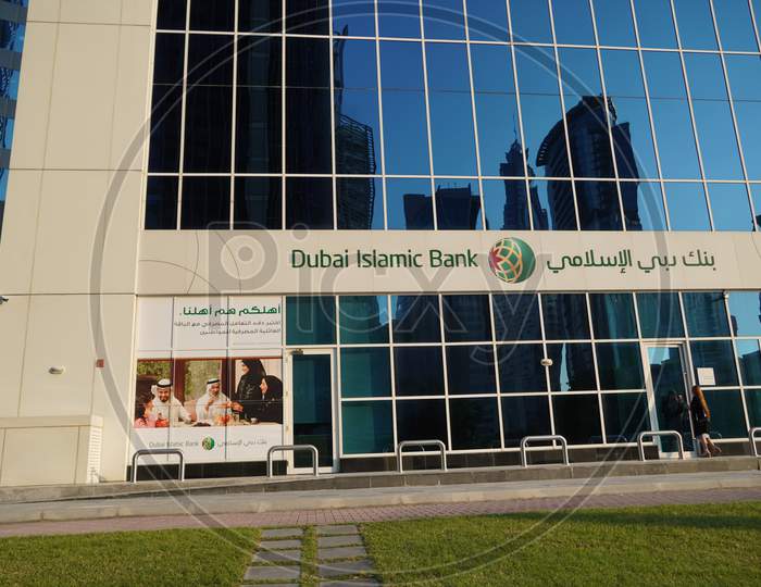 Dubai Islamic Bank A Major Middle Eastern Banks Building Sign Logo On Large Building Top On A Sunny Day. Bank Branch Store Front.