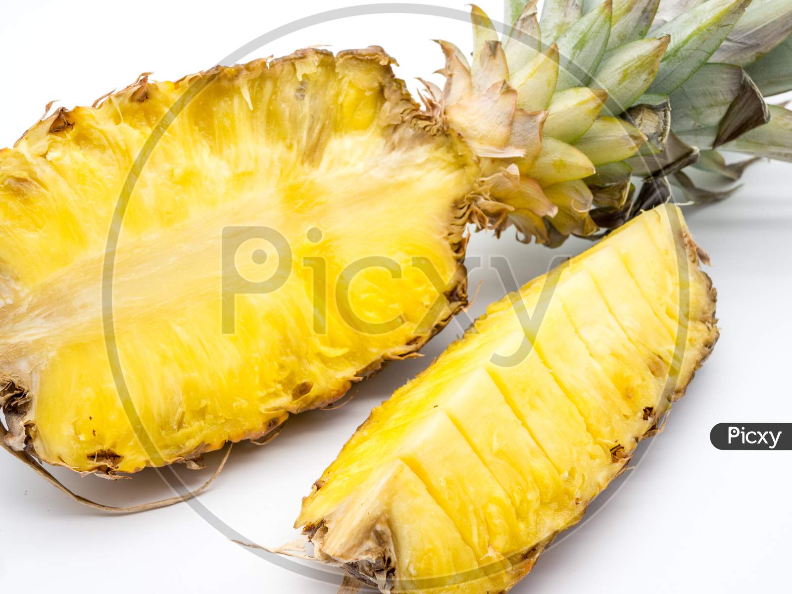 half sliced pineapple on white