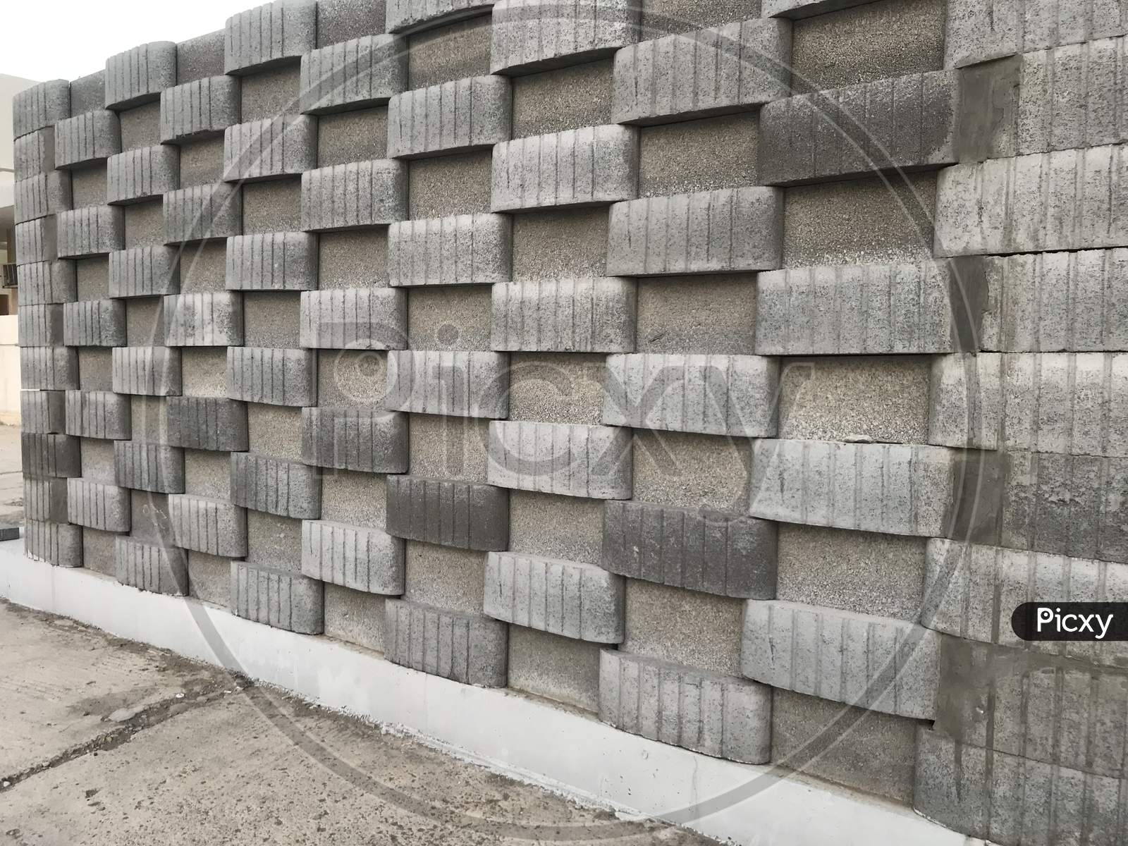 Isometric View Of Concrete Block Wall Constructed For Public Toilet In Three Dimensional View Like In And Out Pattern Using Blocks Cement And Sand